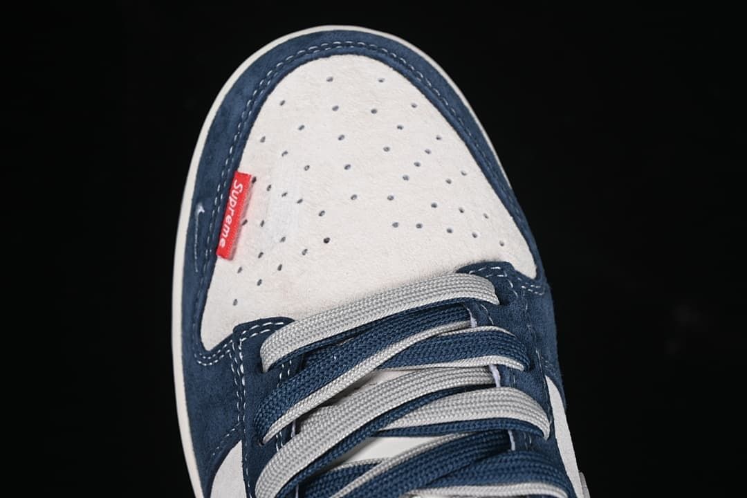 Top view of perforated toe box with a red tag and contrasting laces