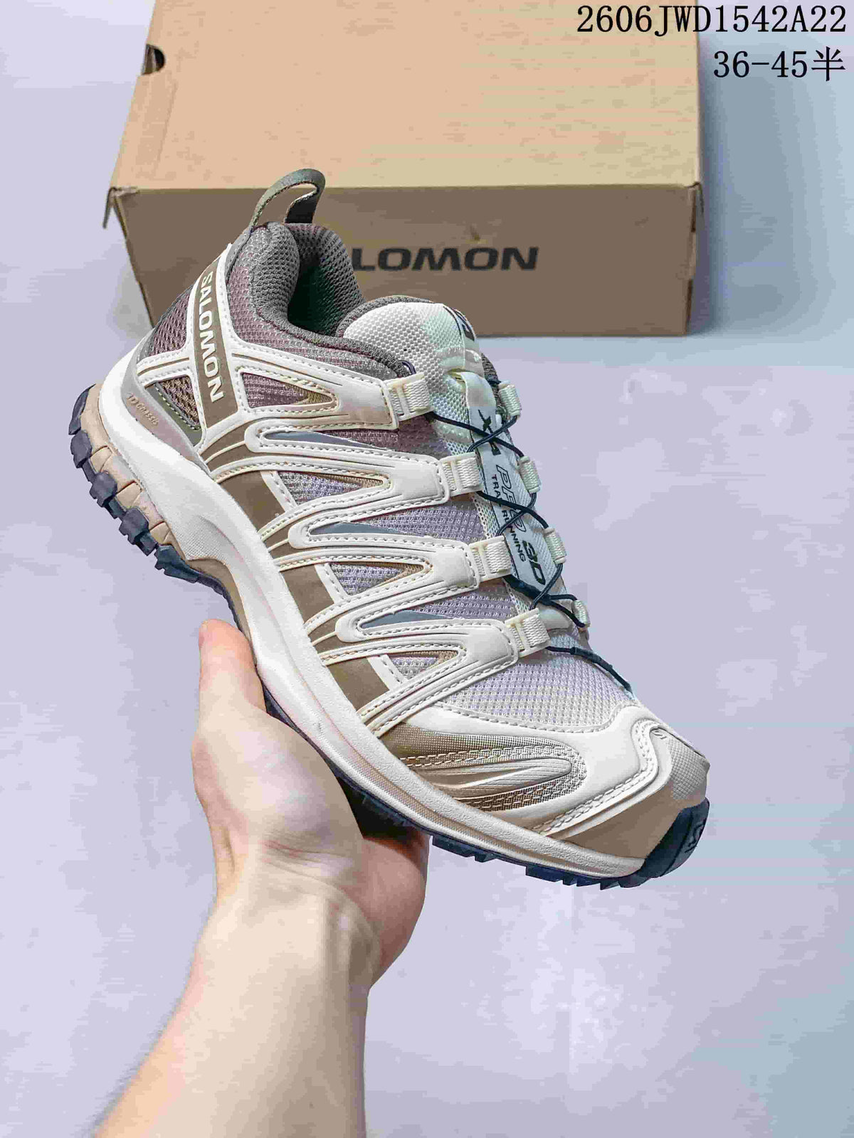 Angled side view of the cream, gray, and muted olive Salomon sneaker