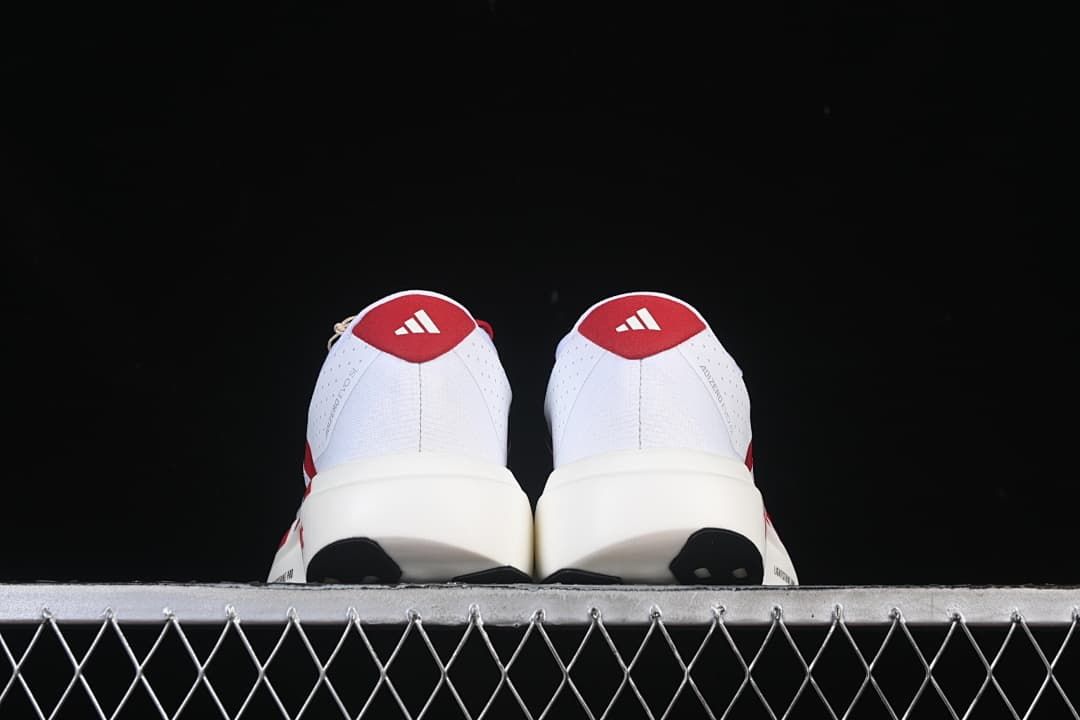 Rear view of both shoes with red heel panels
