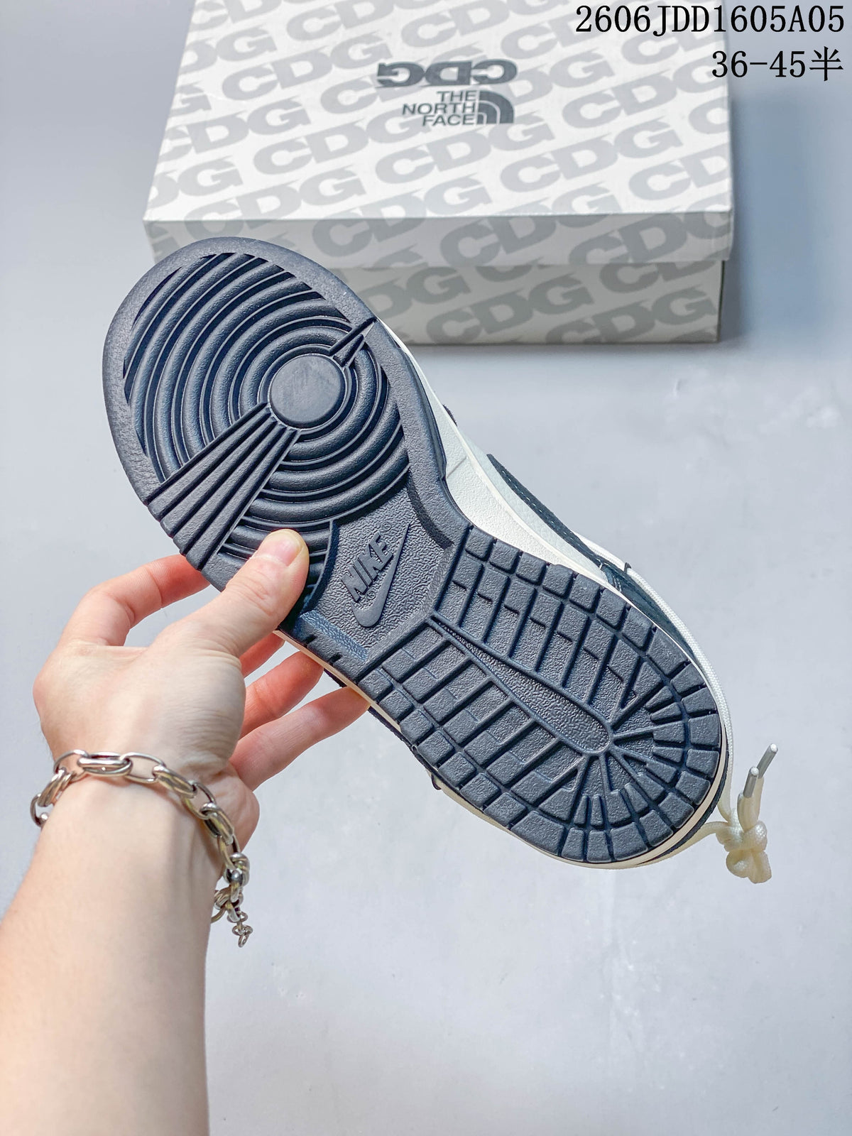 View of the dark navy outsole and patterned shoebox