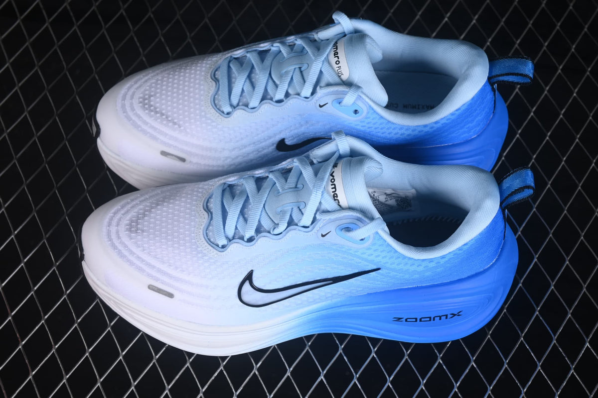 Angled view of the pair showing the patterned upper, padded collars, black Swooshes, and blue midsoles.