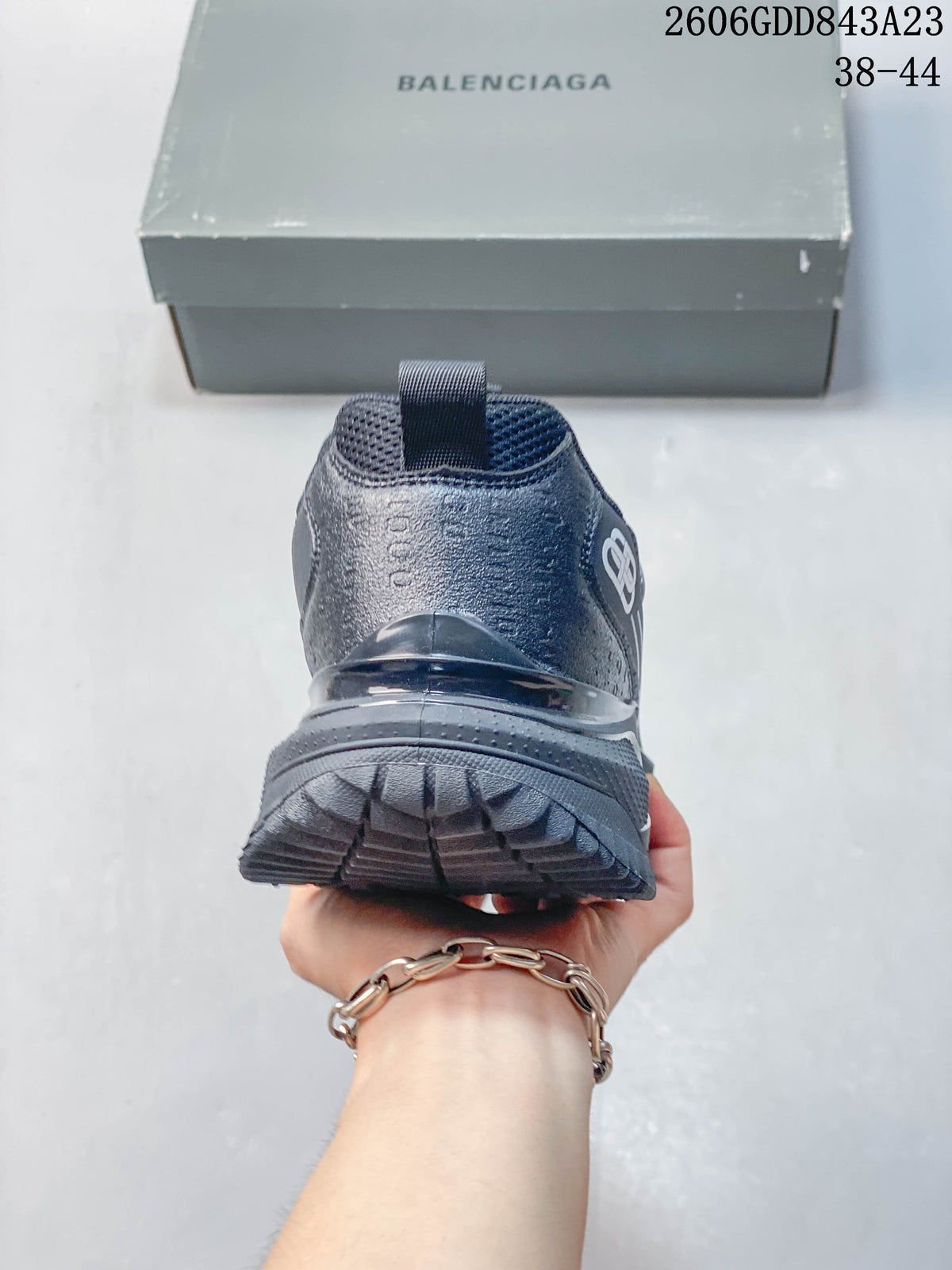 Rear view of the gray sneaker showing heel and outsole details