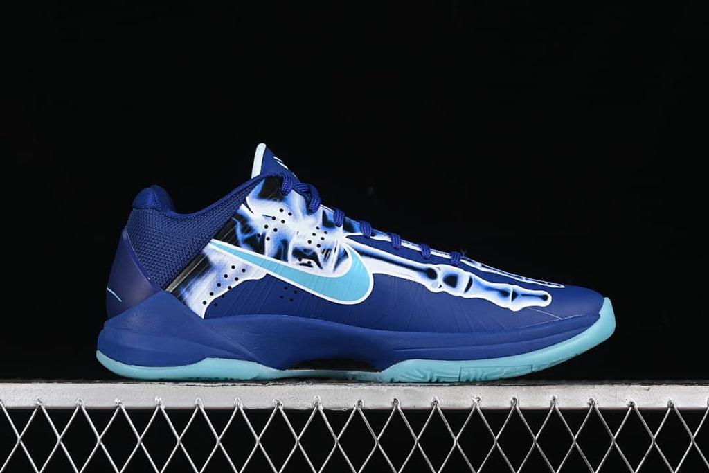 Side profile of blue basketball shoe with skeleton graphic and aqua accents
