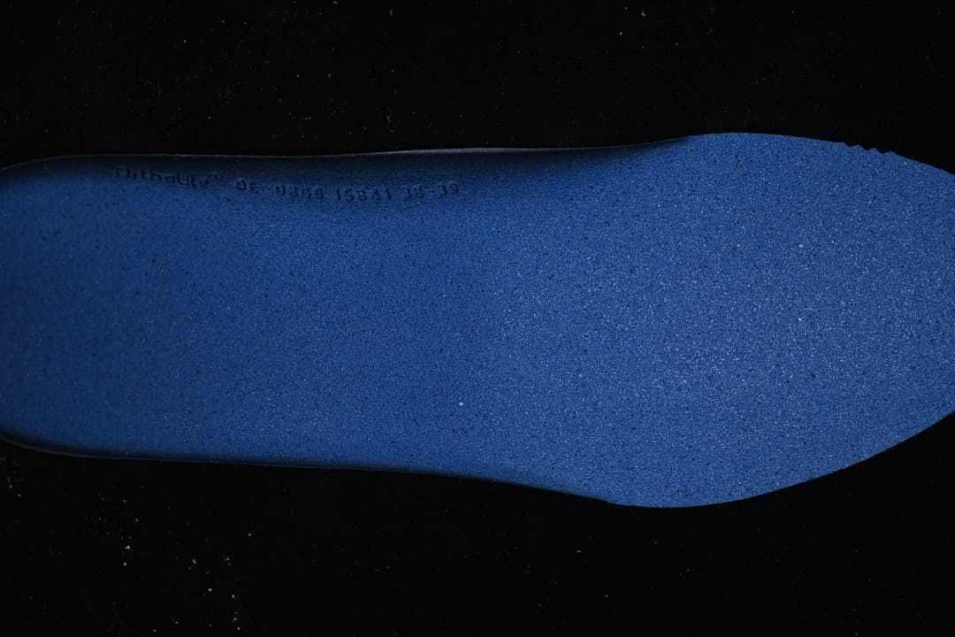 Close-up of a blue shoe insole.