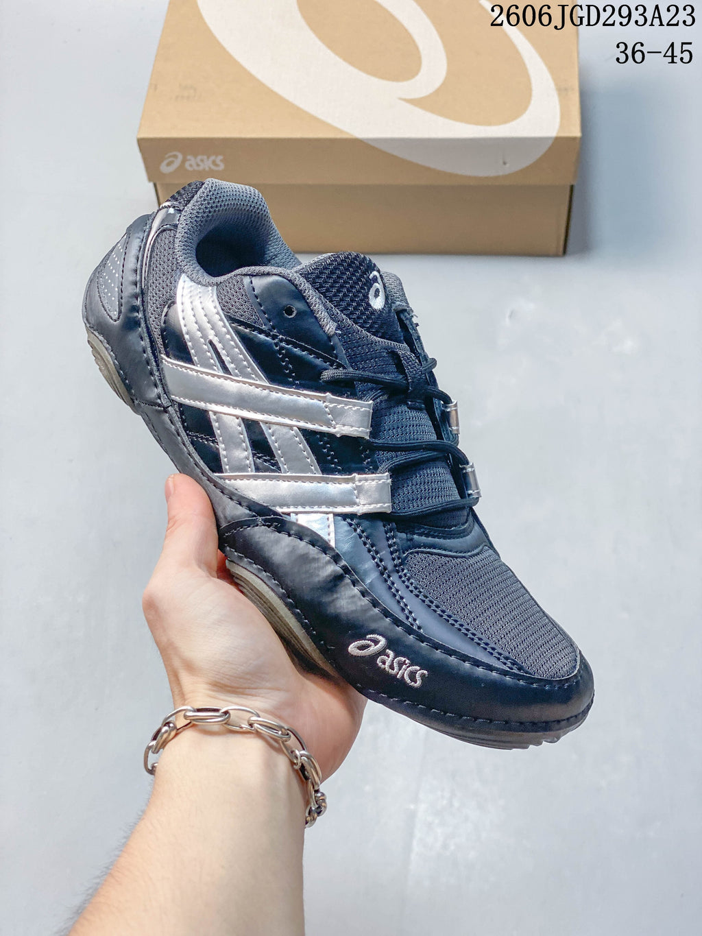 Navy ASICS Gel-Pickax sneaker with silver side overlays and gray mesh.