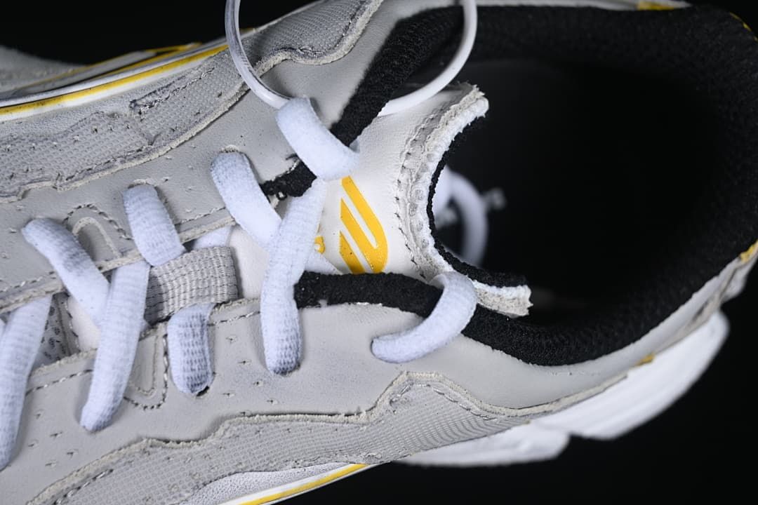 Close-up of white laces and layered upper panels