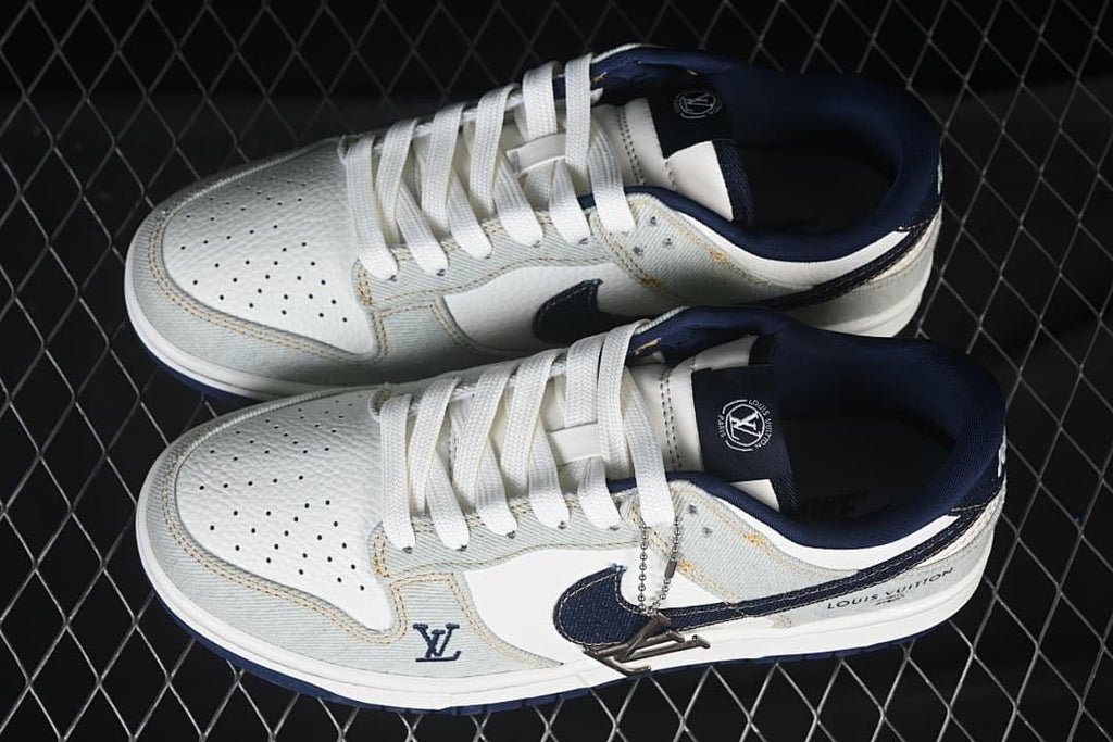 Top view of the sneakers showing perforated toes, white laces, and navy accents