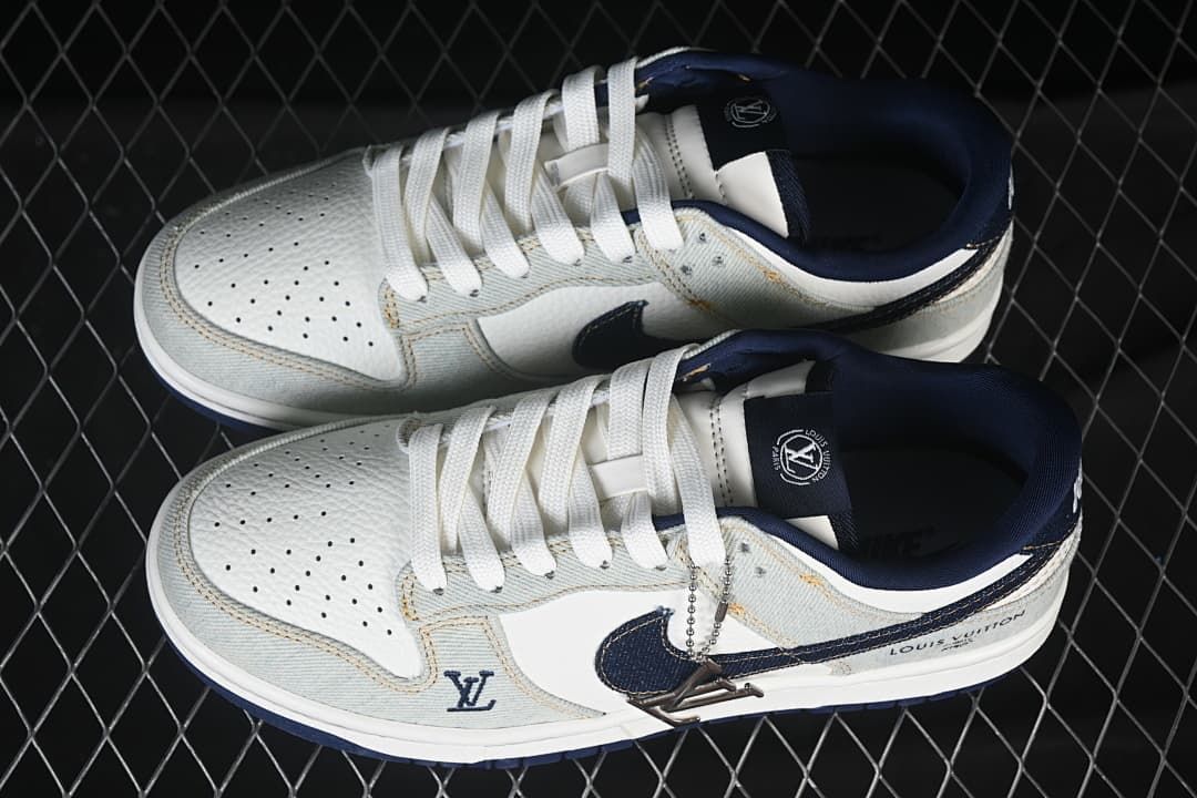 Top view of the sneakers showing perforated toes, white laces, and navy accents