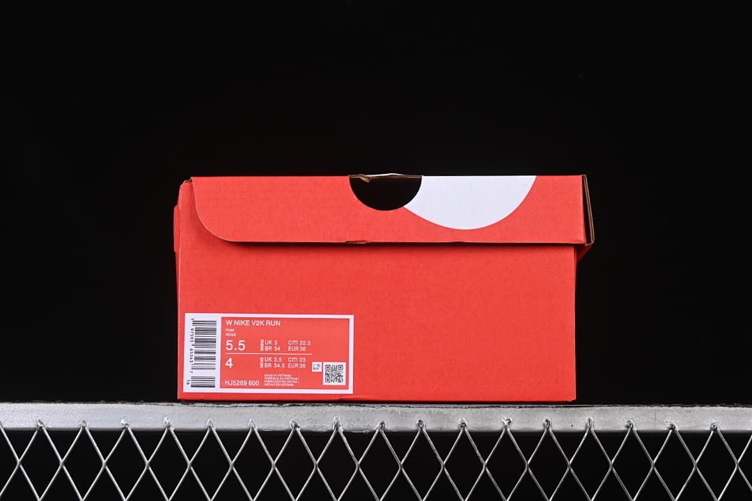 Nike V2K Run shoe box label showing the sample size and style code
