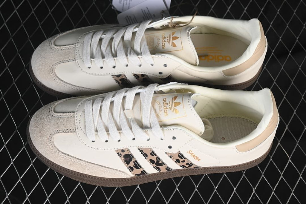 Pair of off-white Samba OG sneakers with leopard-patterned side stripes