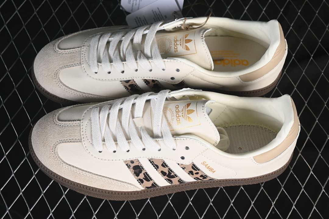 Pair of off-white Samba OG sneakers with leopard-patterned side stripes