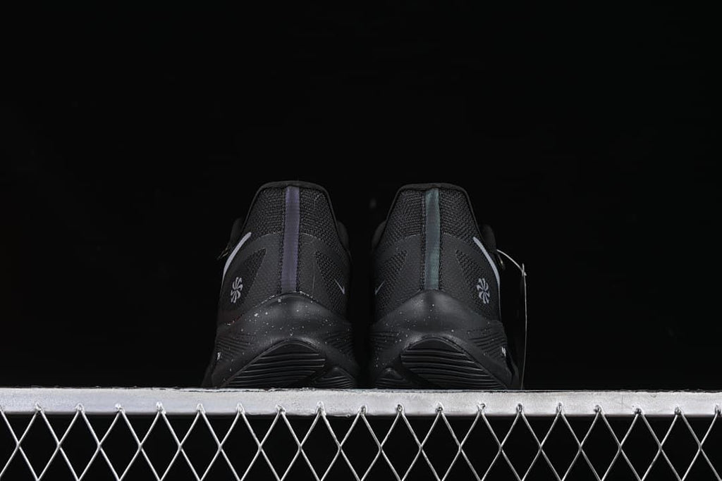 Rear view of the pair showing heel details and speckled midsoles.