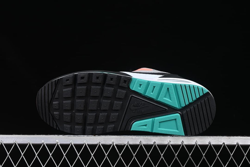 Underside view showing the black and teal patterned outsole.