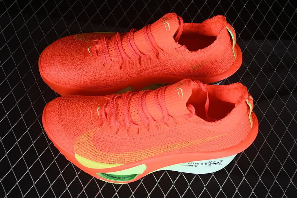 Pair of bright-crimson shoes shown from above at an angle.