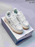 Pair of white MLB Chunky Liner low-top sneakers with gum-colored outsoles, shown on a branded box.