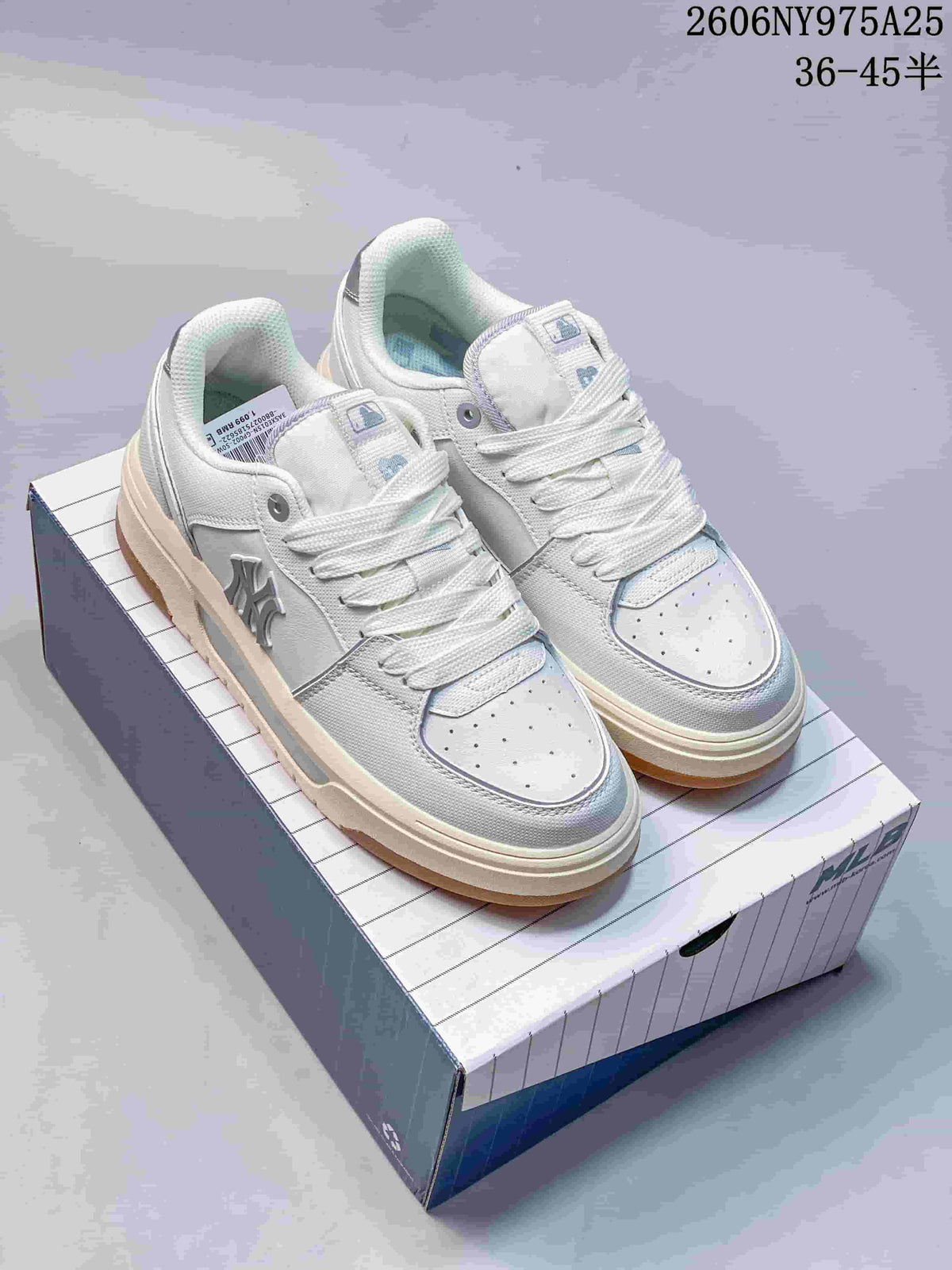 Pair of white MLB Chunky Liner low-top sneakers with gum-colored outsoles, shown on a branded box.