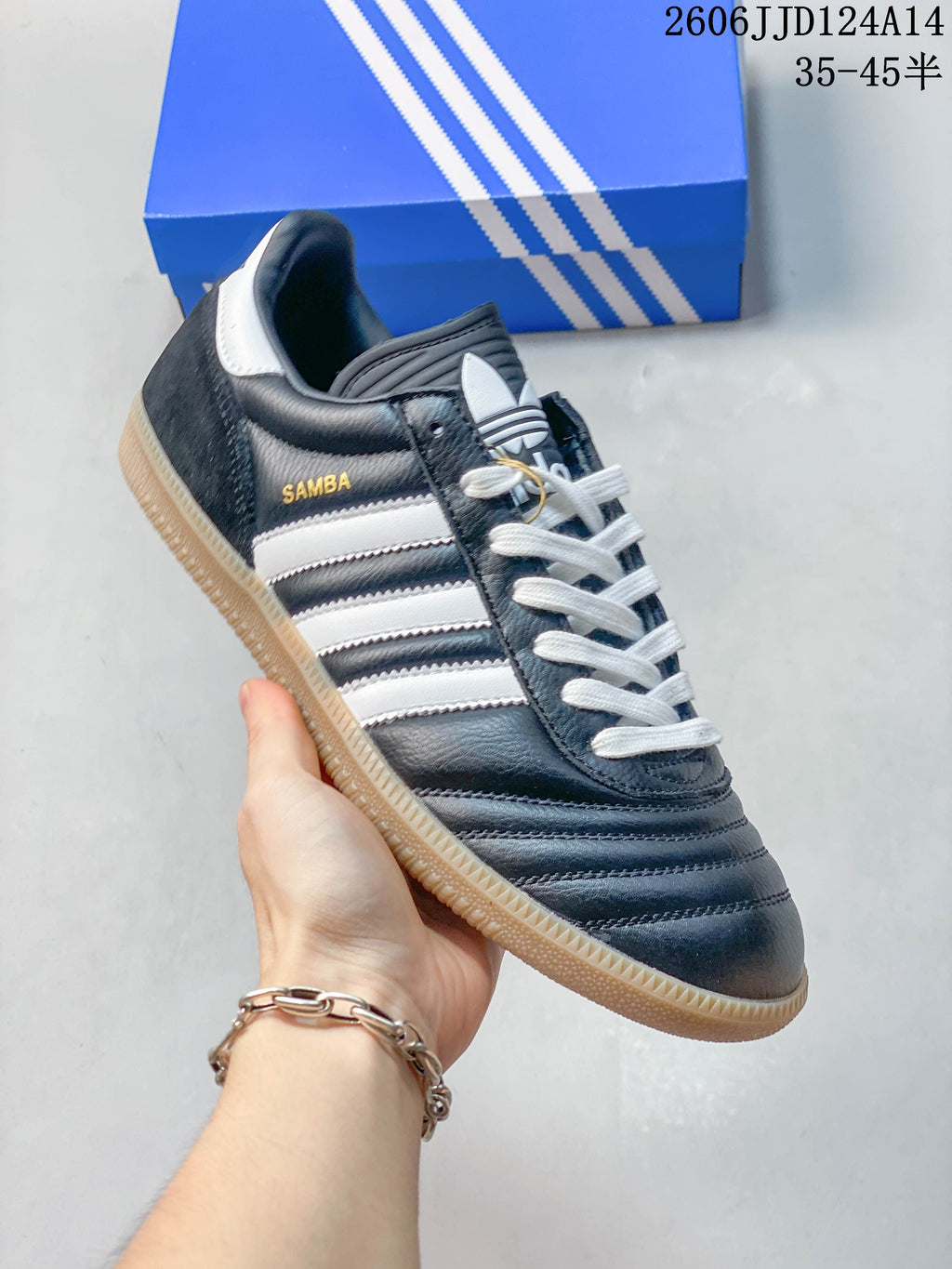 Angled side view showing the dark blue upper, white stripes, and contrasting heel