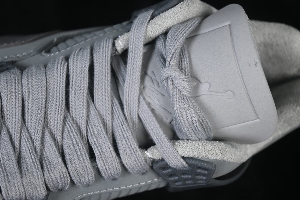Close-up of the grey laces and tongue area on an Air Jordan 4 Retro SE.