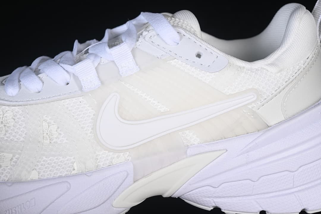 Close-up of the side Swoosh, laces and layered panels