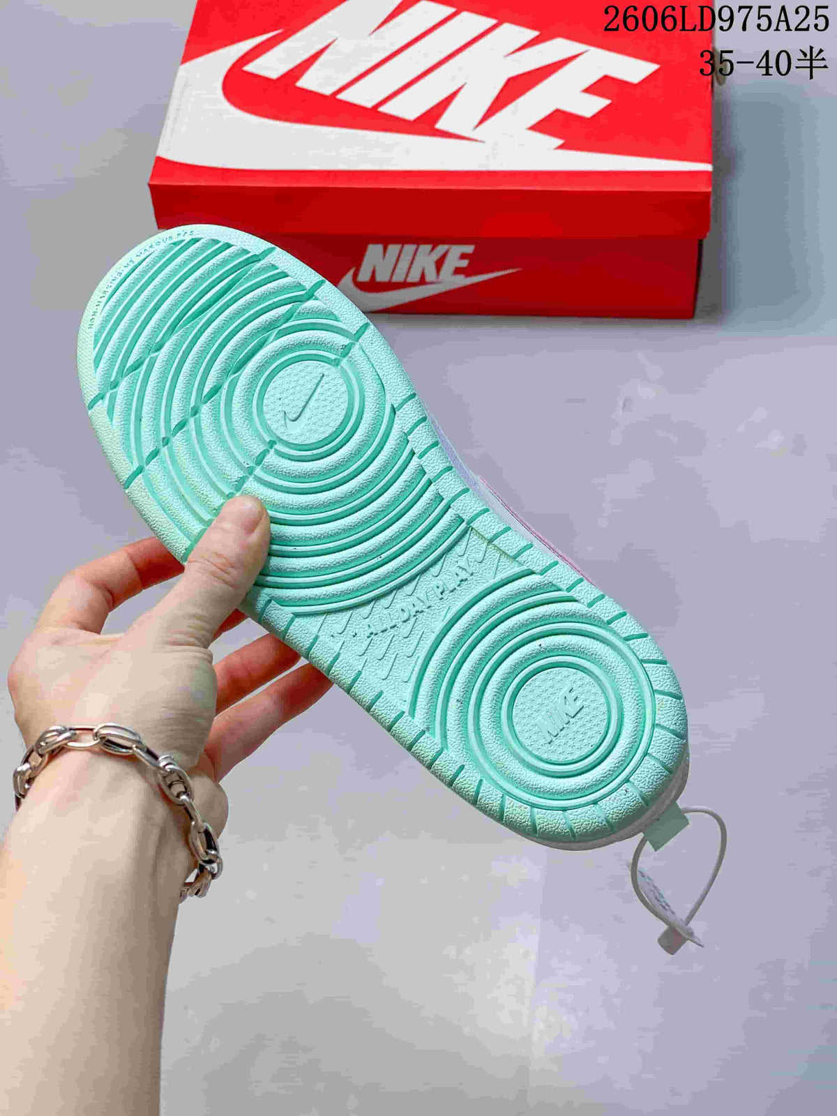 Mint-green outsole of a Nike Court Borough Low sneaker.