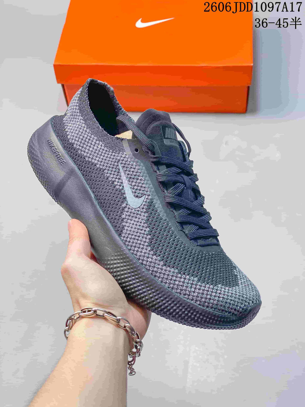 Dark gray Nike Free 2025 low-top shoe with a dark sole.