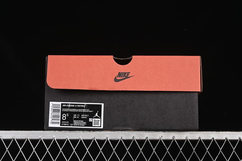 Nike shoe box with an Air Jordan 12 Retro label showing sample size EU 42