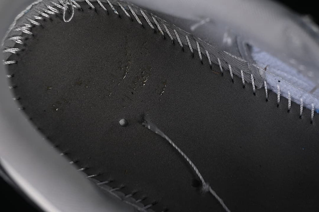 Close-up inside the sneaker showing stitching and interior construction.