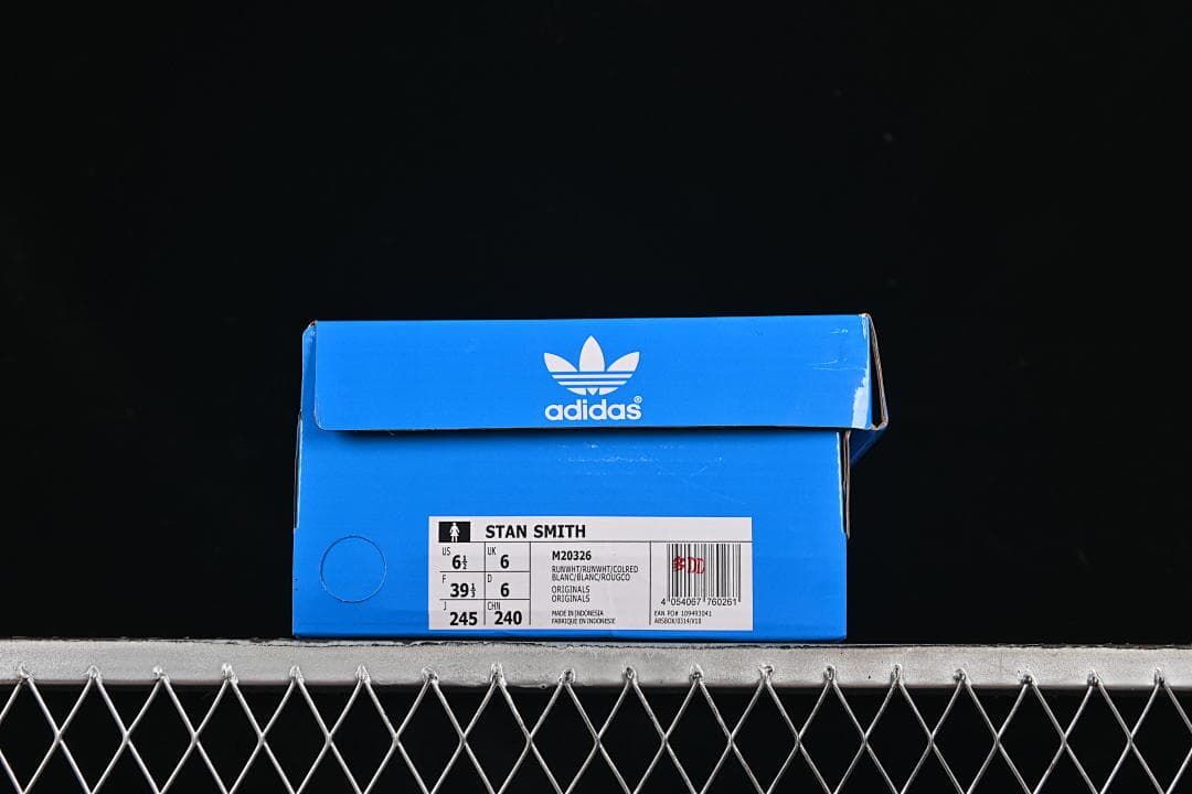 Blue adidas shoe box with a Stan Smith label showing sample size US 6.5, UK 6 and FR 39 1/3