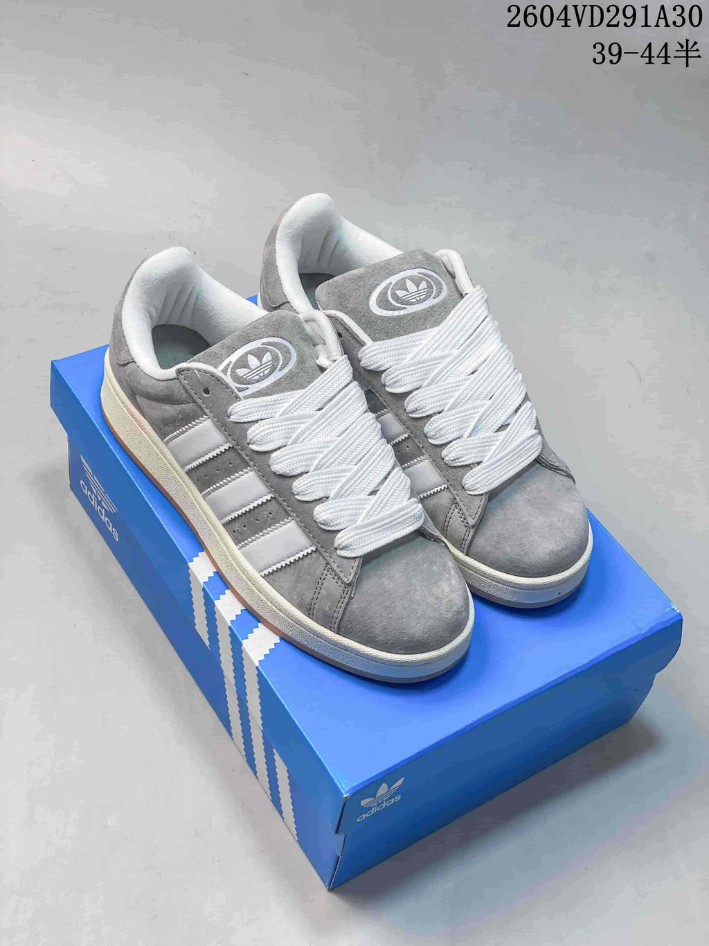 Several Adidas Campus sneakers shown in dark navy, grey, and pink; size ranges are printed in the image.