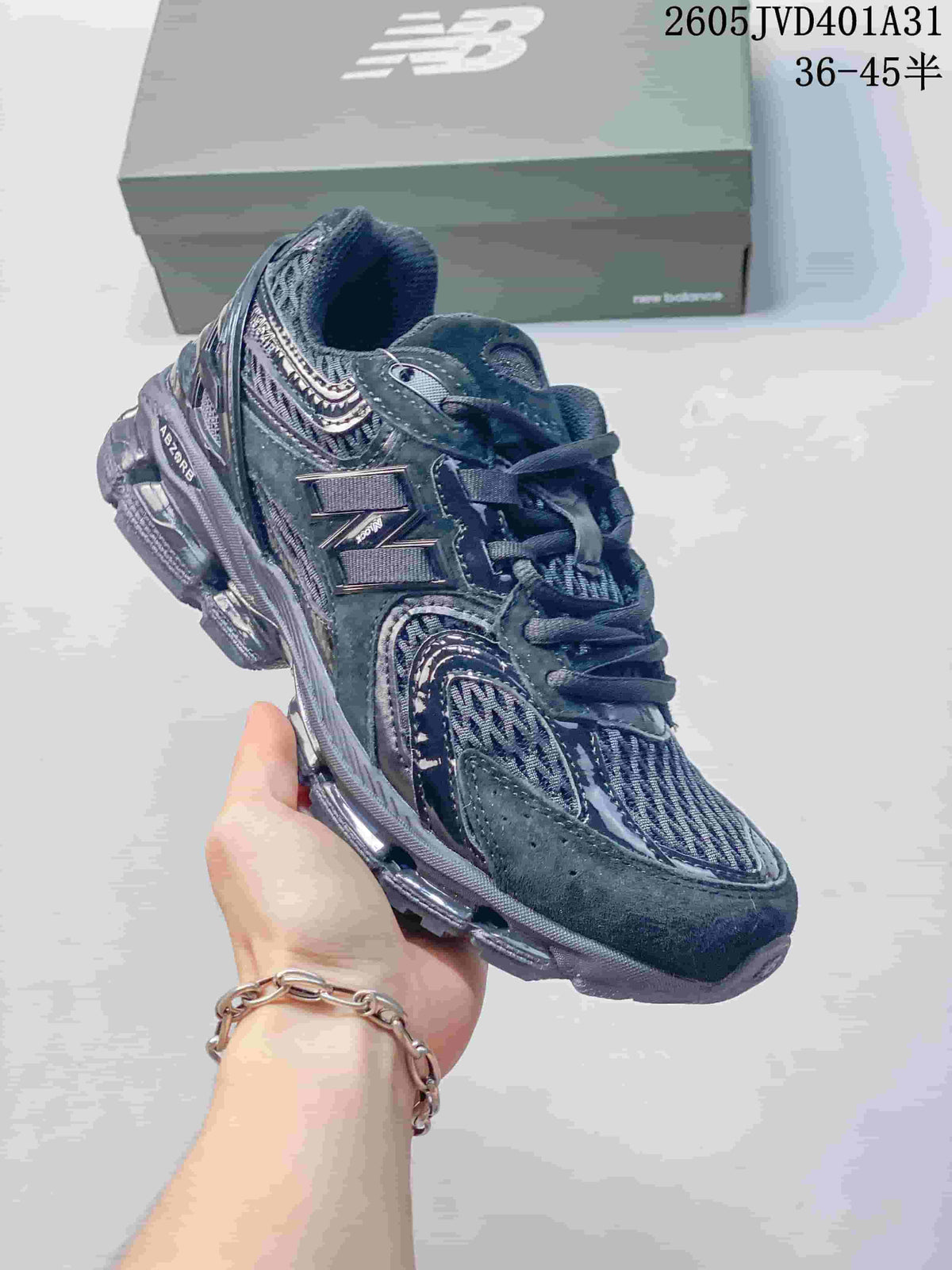 Angled side view of a charcoal gray New Balance sneaker showing the layered upper and segmented outsole; size range text appears in the image.