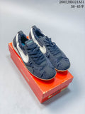 Navy Nike Jacquemus Moon Shoe SP sneakers with white side logos on an orange box.