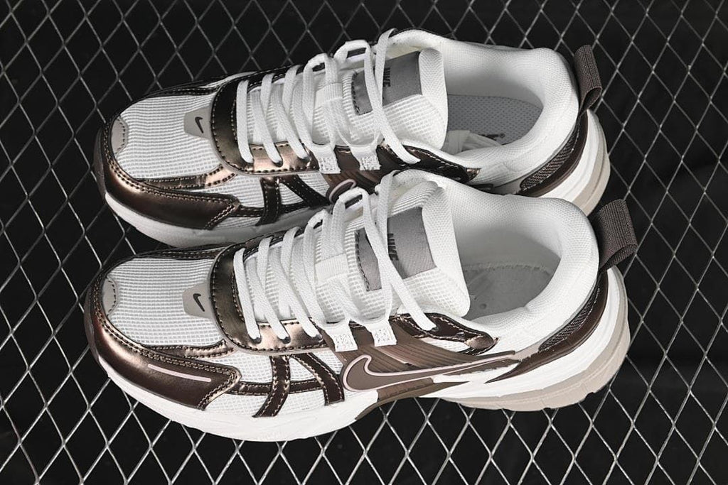 Pair of white and brown Nike V2K Run sneakers viewed from above