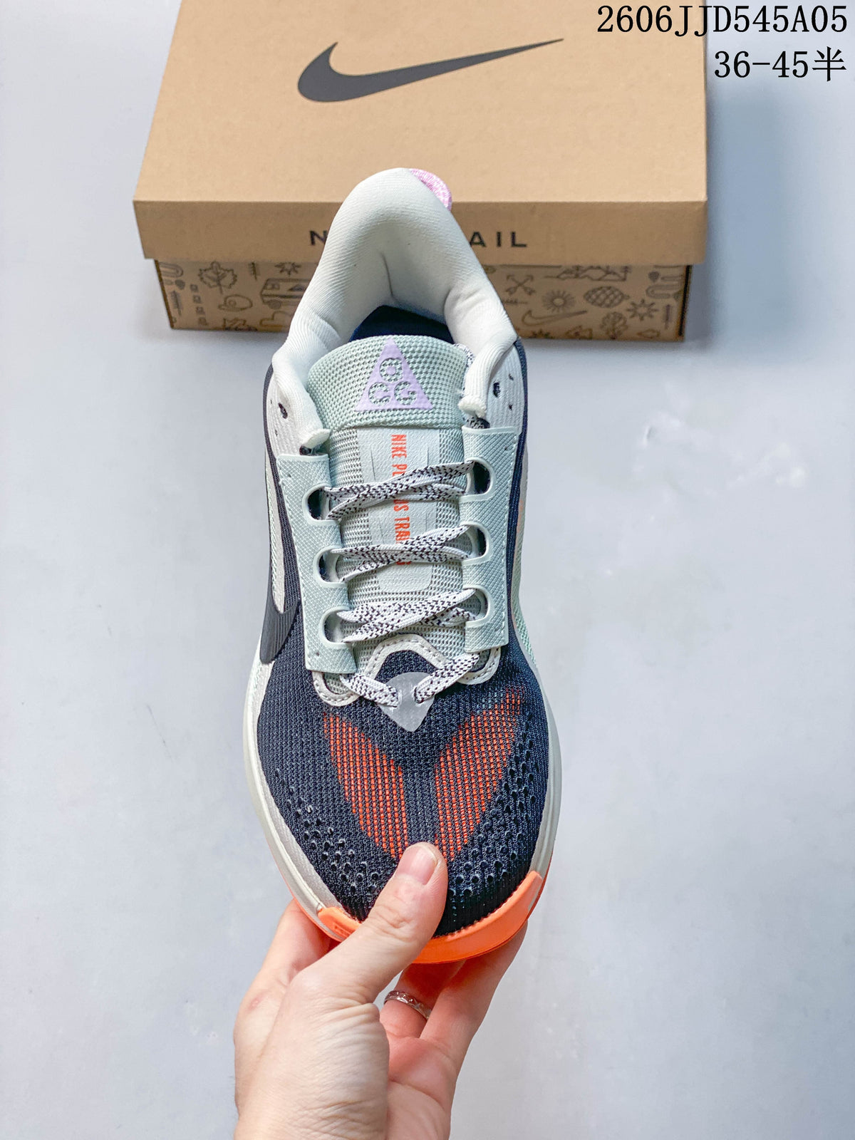Top view of a Nike ACG Pegasus Trail 6 shoe showing its patterned laces and multicolor upper.