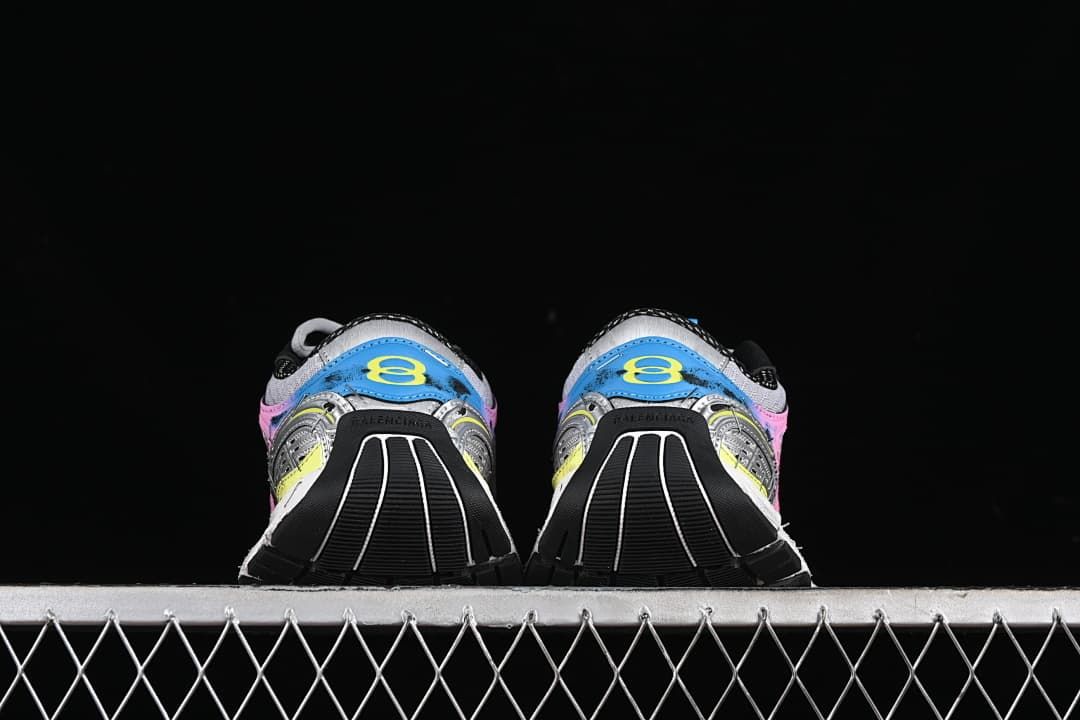 Rear view of both sneakers showing blue heel panels and black outsole sections