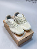 Pair of cream ASICS Gel-Pickax sneakers displayed on a shoebox