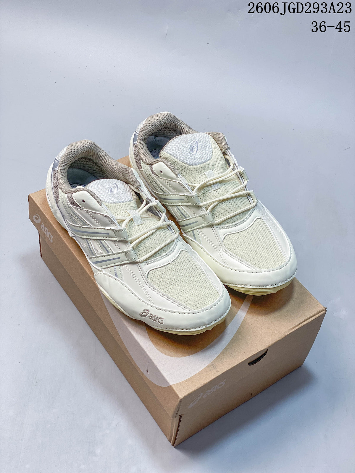 Pair of cream ASICS Gel-Pickax sneakers displayed on a shoebox