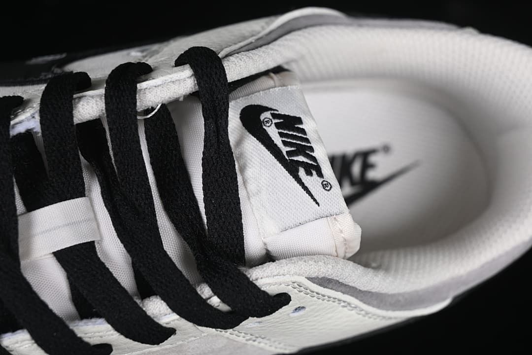 Close-up of black laces, tongue label, and padded collar