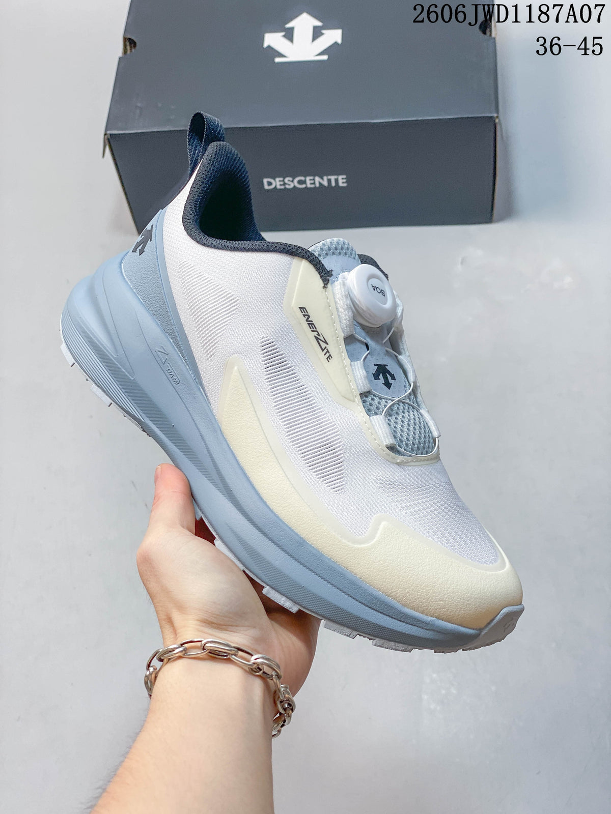 Angled side view of the white sneaker with pale blue-gray and cream accents.