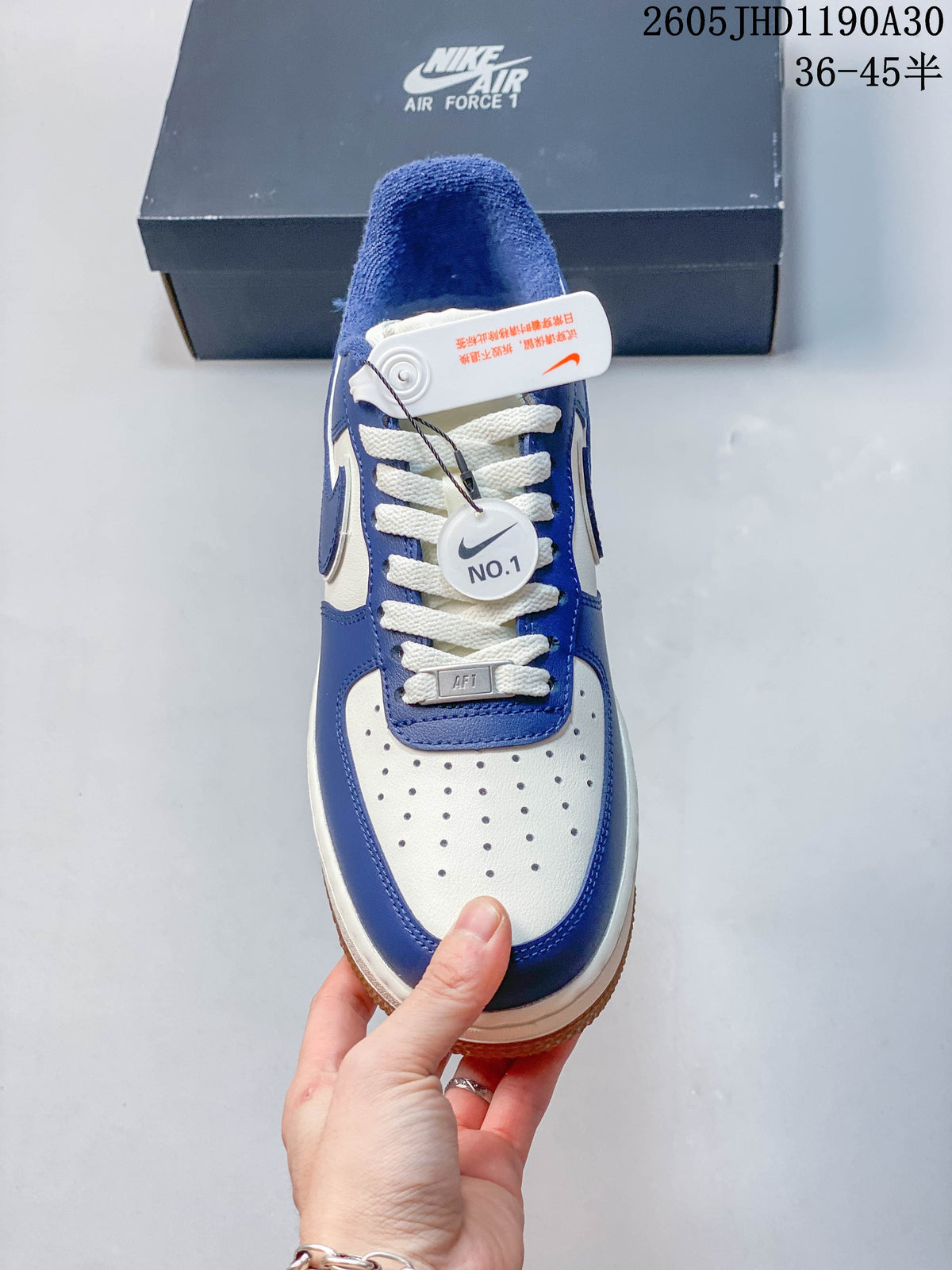 Top view showing the perforated toe box, white laces, and blue overlays.