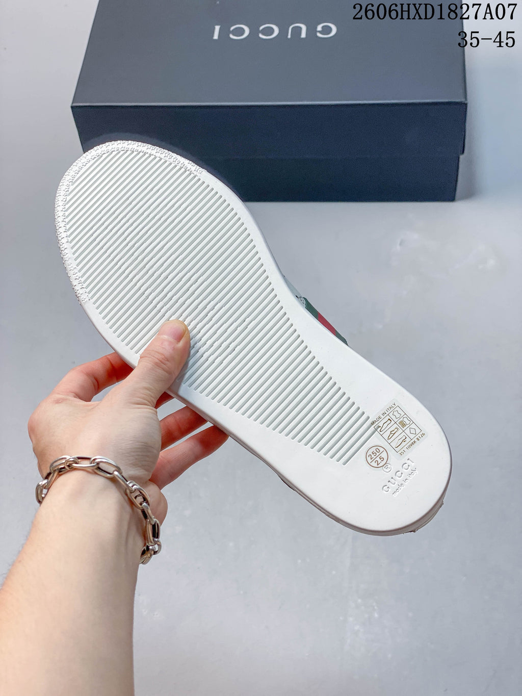 Underside of a white sneaker; image overlay shows size range 35–45 and style code 2606HXD1827A07