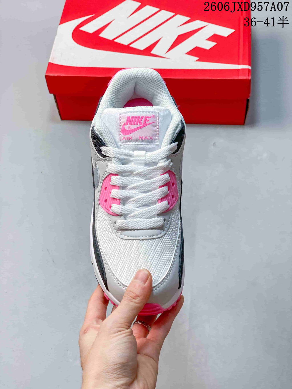 Top view of the white, gray, black, and pink Nike Air Max 90 sneaker