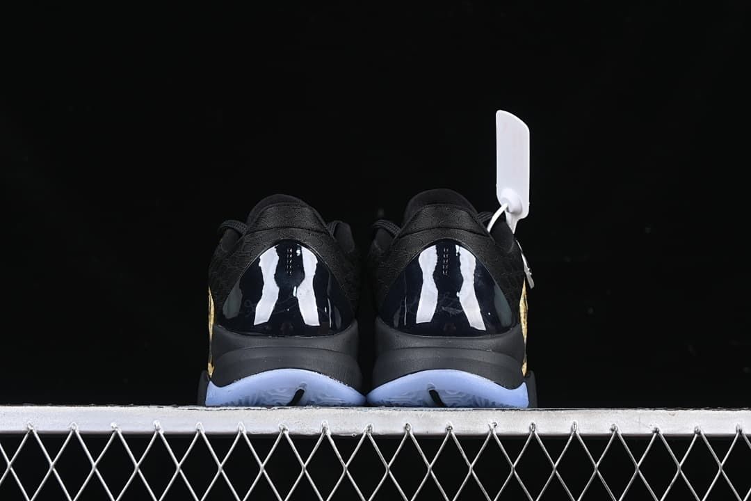 Rear view of the pair showing glossy heel panels and pale blue outsoles