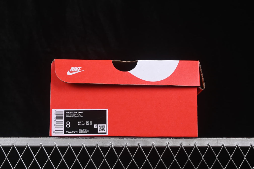 Red Nike shoebox with a visible label identifying Nike Dunk Low and style code WG0319-146.