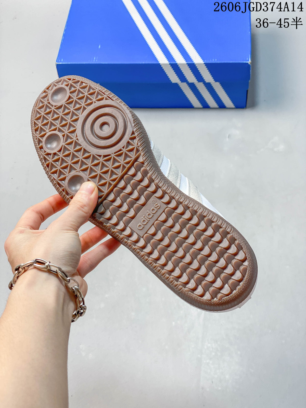 Close-up of the gum-colored outsole with textured tread on a white low-top sneaker.