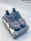 Pair of dark gray Adidas Ultraboost 5X shoes on a box, shown from above at an angle.