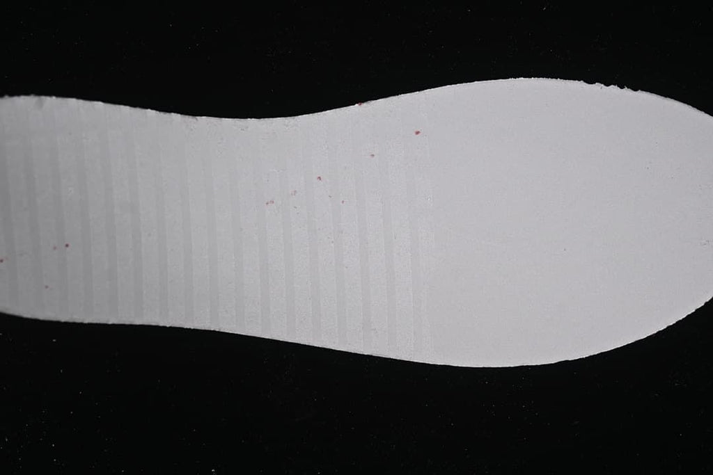 White shoe insole shown against a dark background