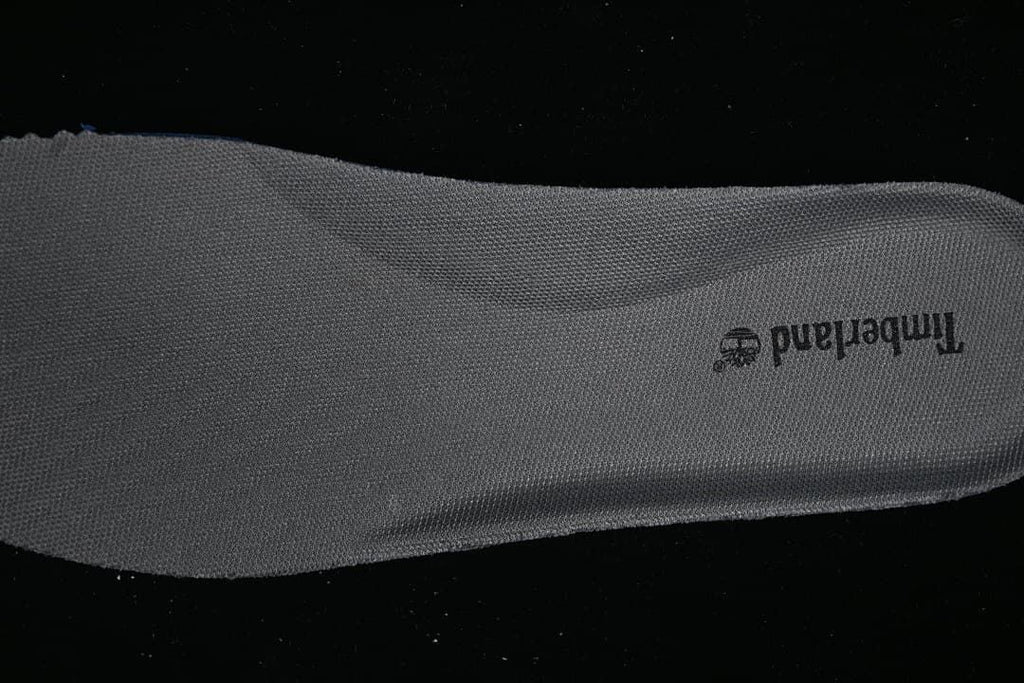Close-up of the gray shoe insole with Timberland branding