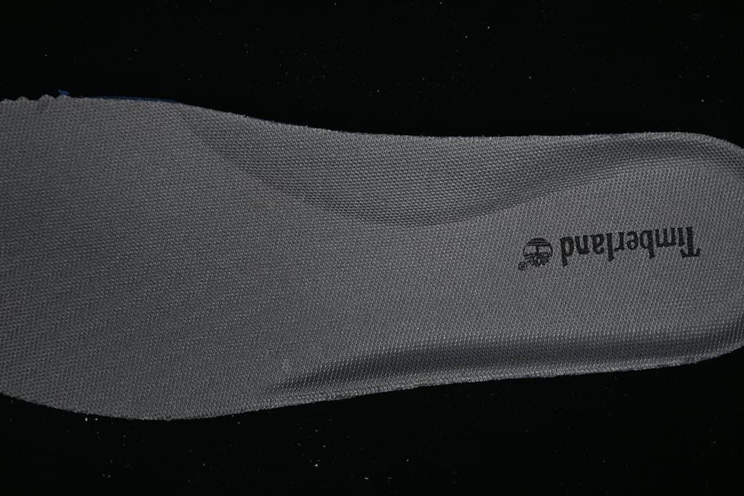 Close-up of the gray shoe insole with Timberland branding