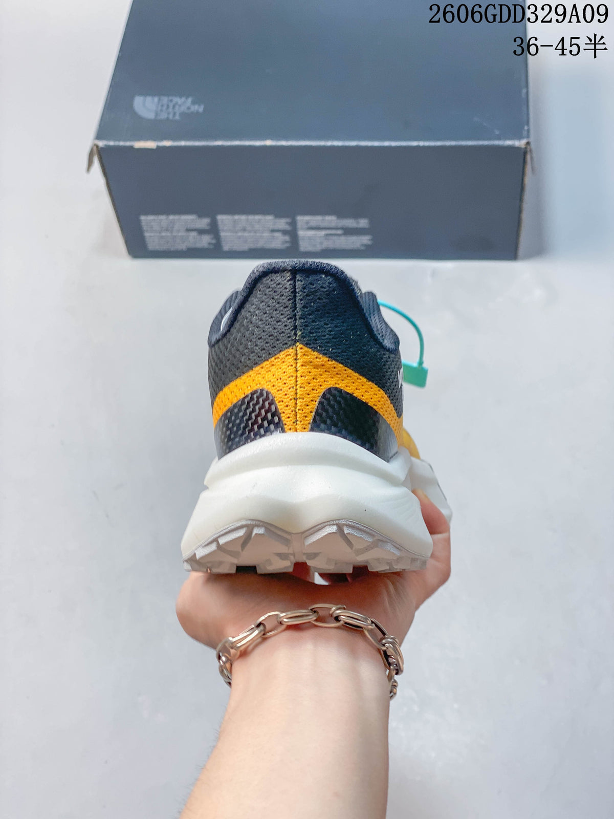Rear view showing the heel, white midsole, and outsole of a hiking shoe.