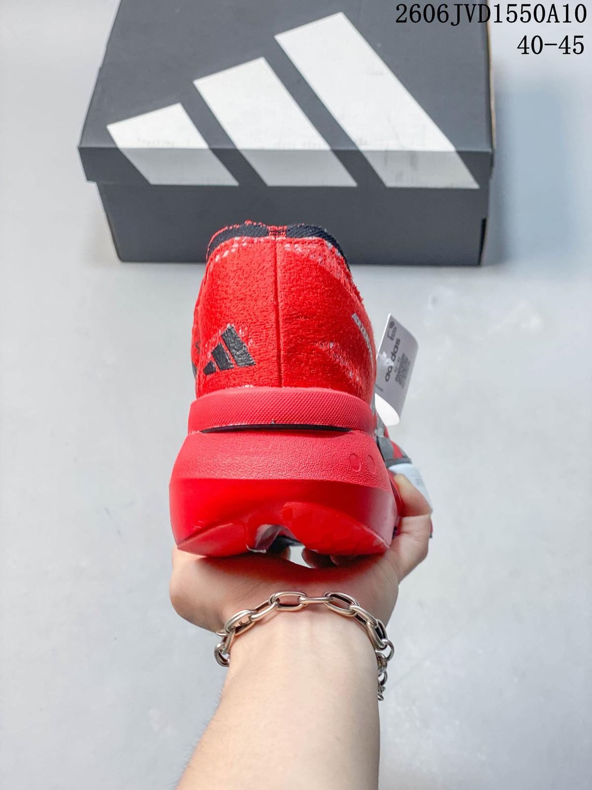 Rear view of a red running shoe with a prominent sculpted heel.